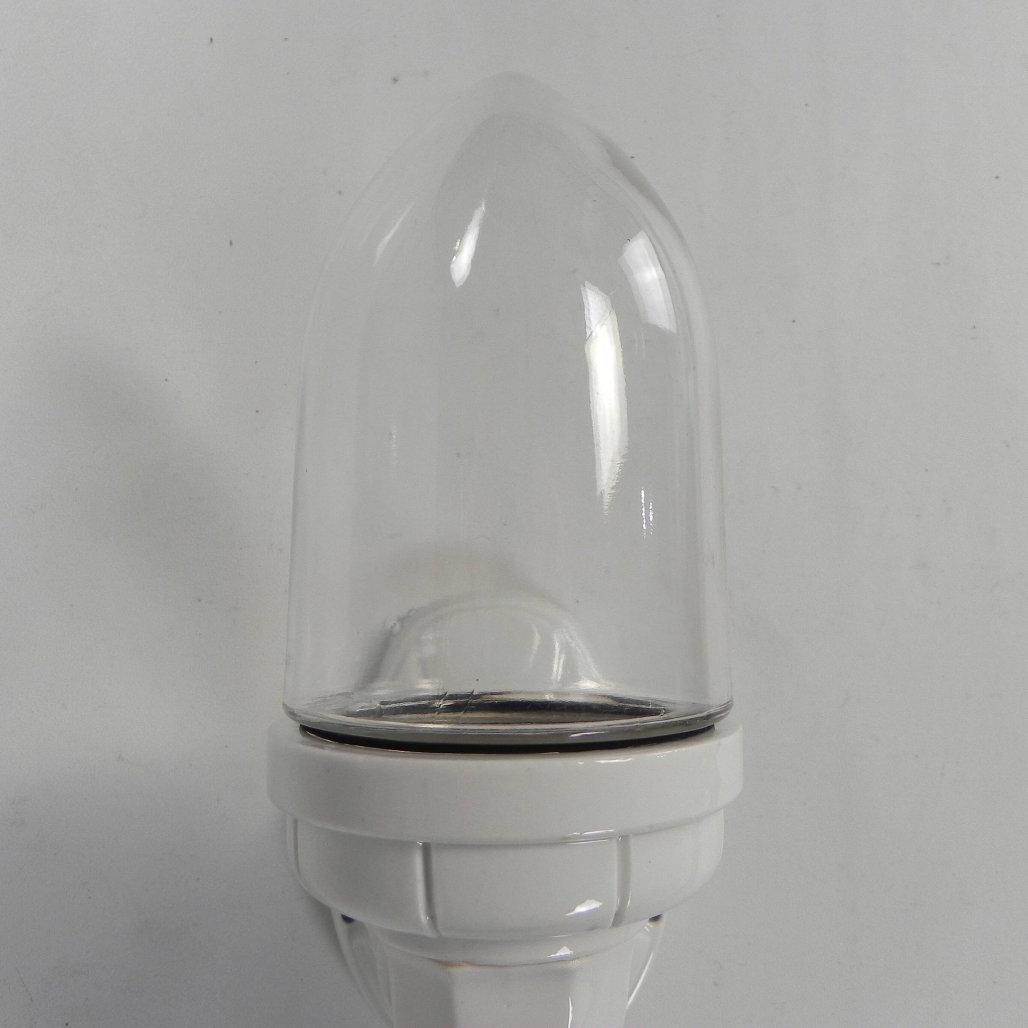 Wall lamp in porcelain with a transparent glass shade, 1930s.