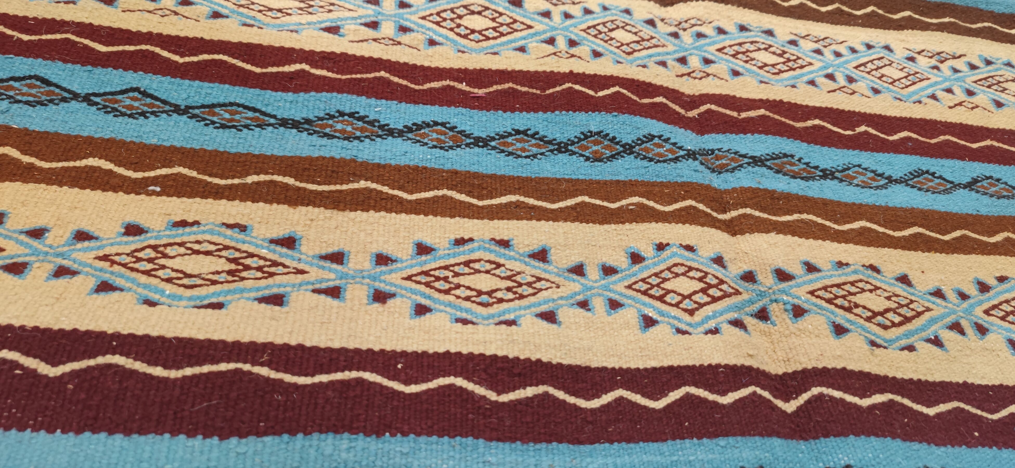 Multicolored hand-woven Berber rugs in natural wool