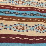 Multicolored hand-woven Berber rugs in natural wool