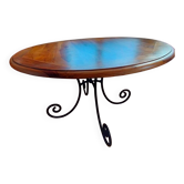 Table ronde en bois et piètement en fer forgé
