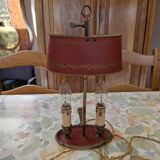 Old silver-plated bronze lamp, except for the arms which are not silver.