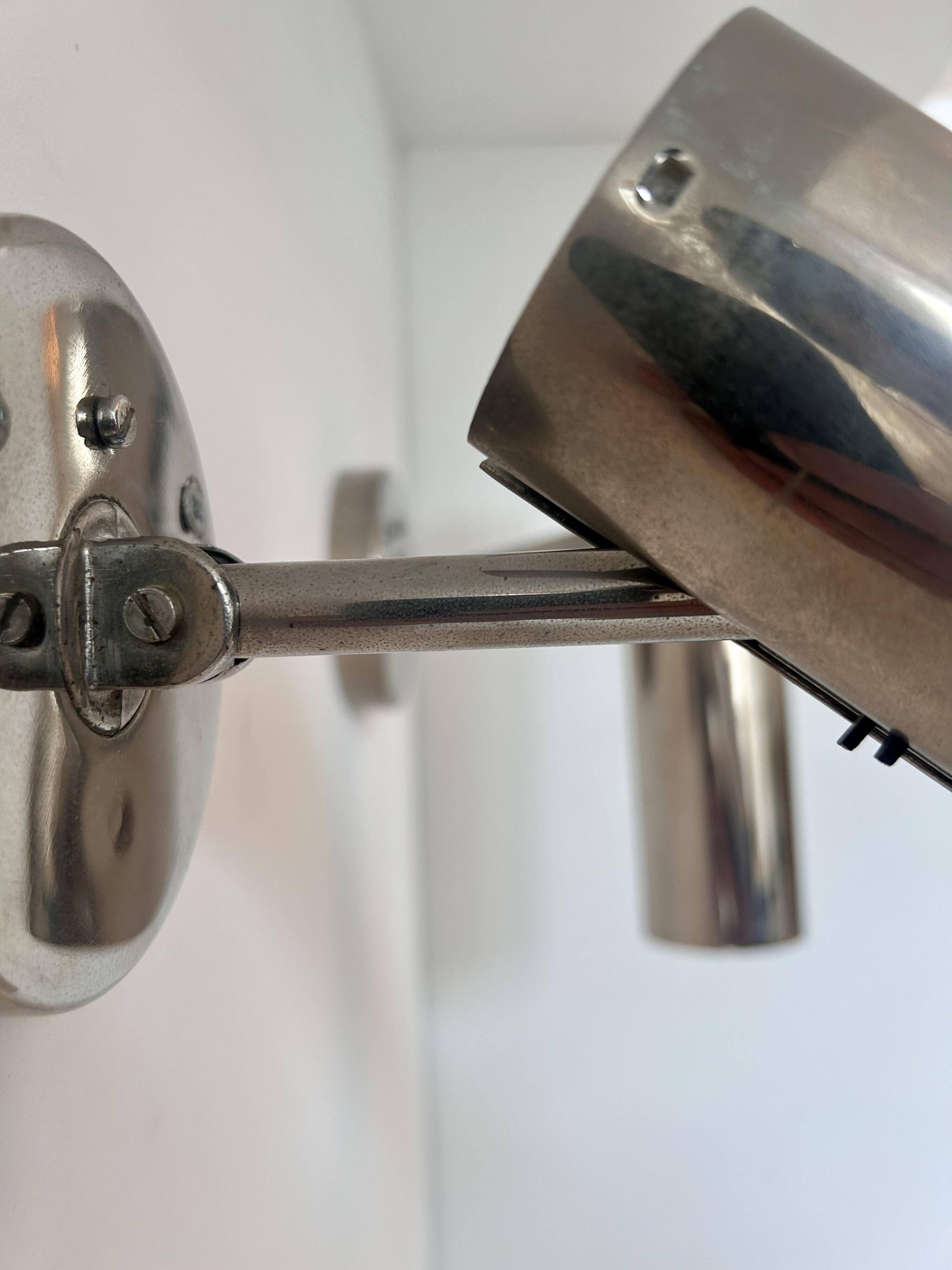 Pair of modernist adjustable wall lights, chrome metal, France 1960