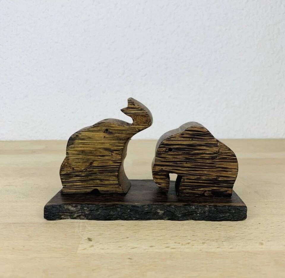 Vintage palm wood elephant salt and pepper shakers.