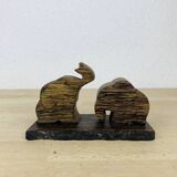 Vintage palm wood elephant salt and pepper shakers.