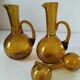 Duo of blown glass carafes – Biot signed – Bubbled amber glass