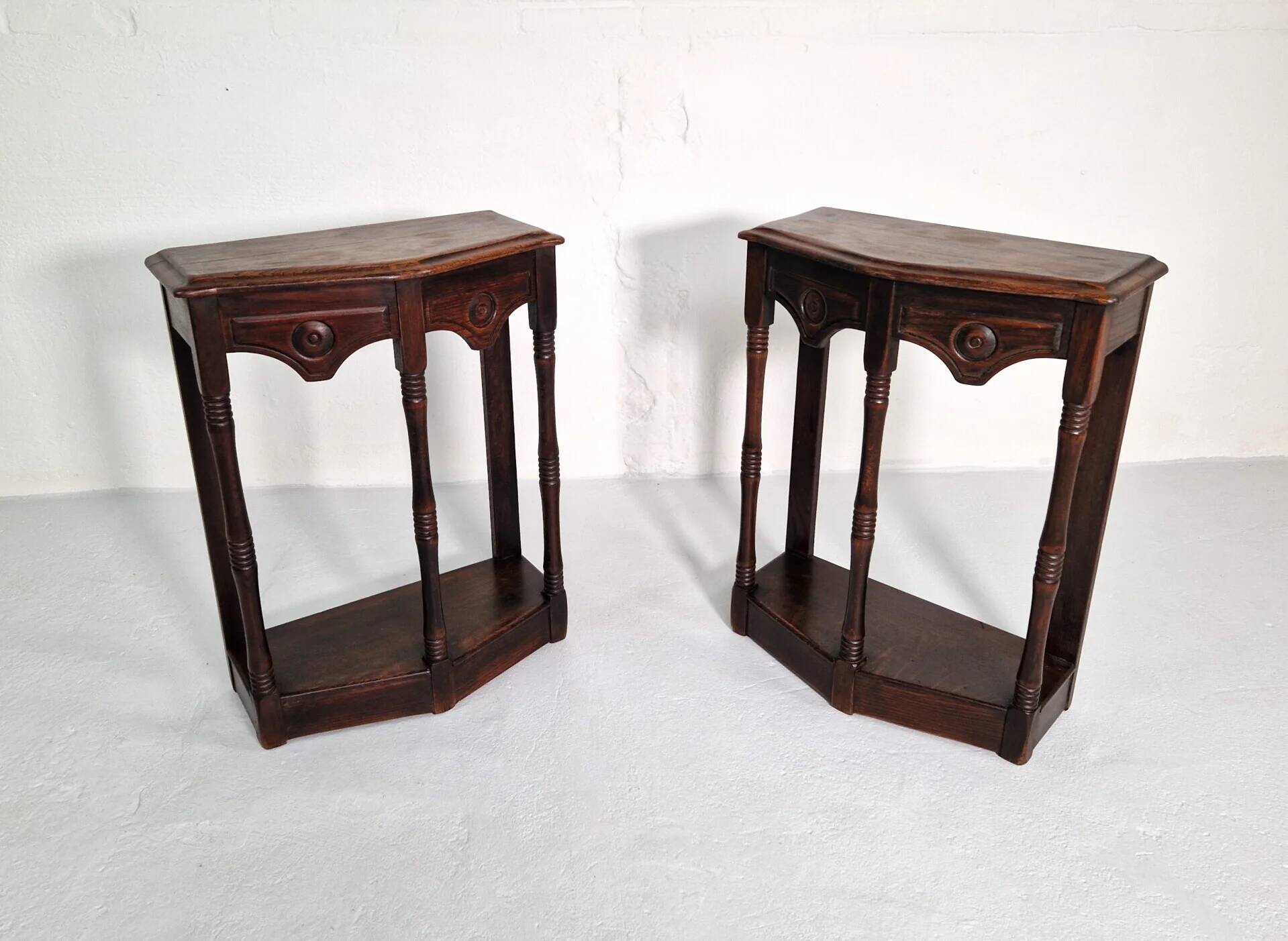 Pair of English 1920s carved oak sidetables