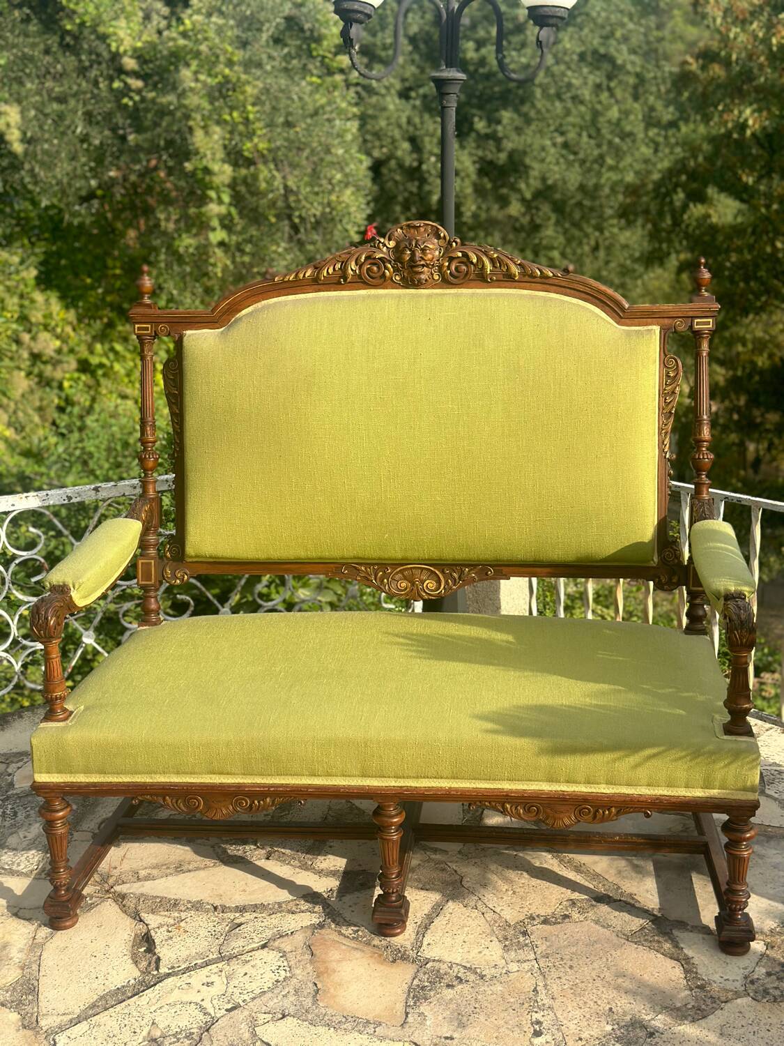 Richly carved solid wood bench in Louis XVI style.