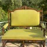 Richly carved solid wood bench in Louis XVI style.