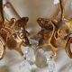 French antique Louis XV style twin arm wall sconces in bronze with crystals.