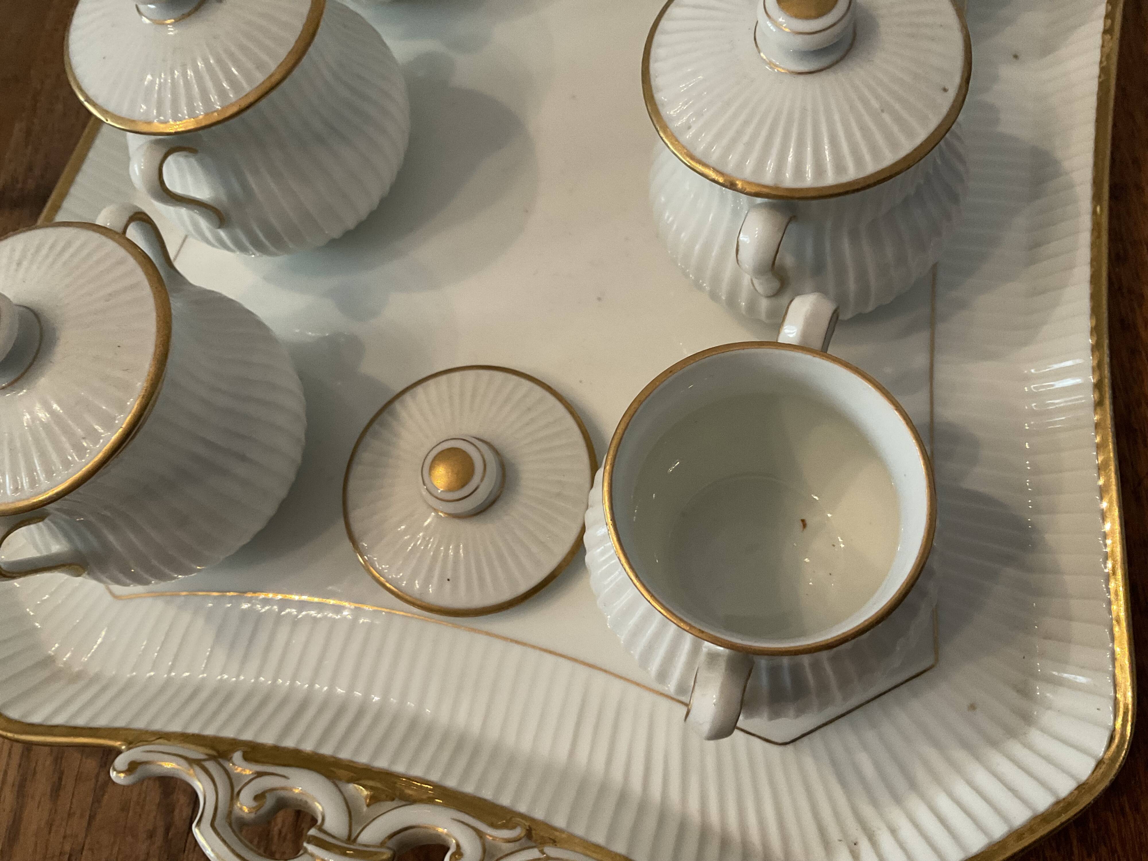 Porcelain tray and 8 matching cream pots. Antique