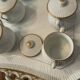 Porcelain tray and 8 matching cream pots. Antique