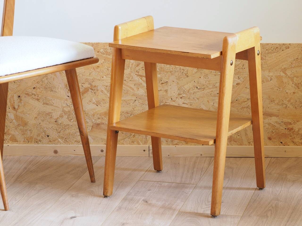 Bedside or side table with compass legs.