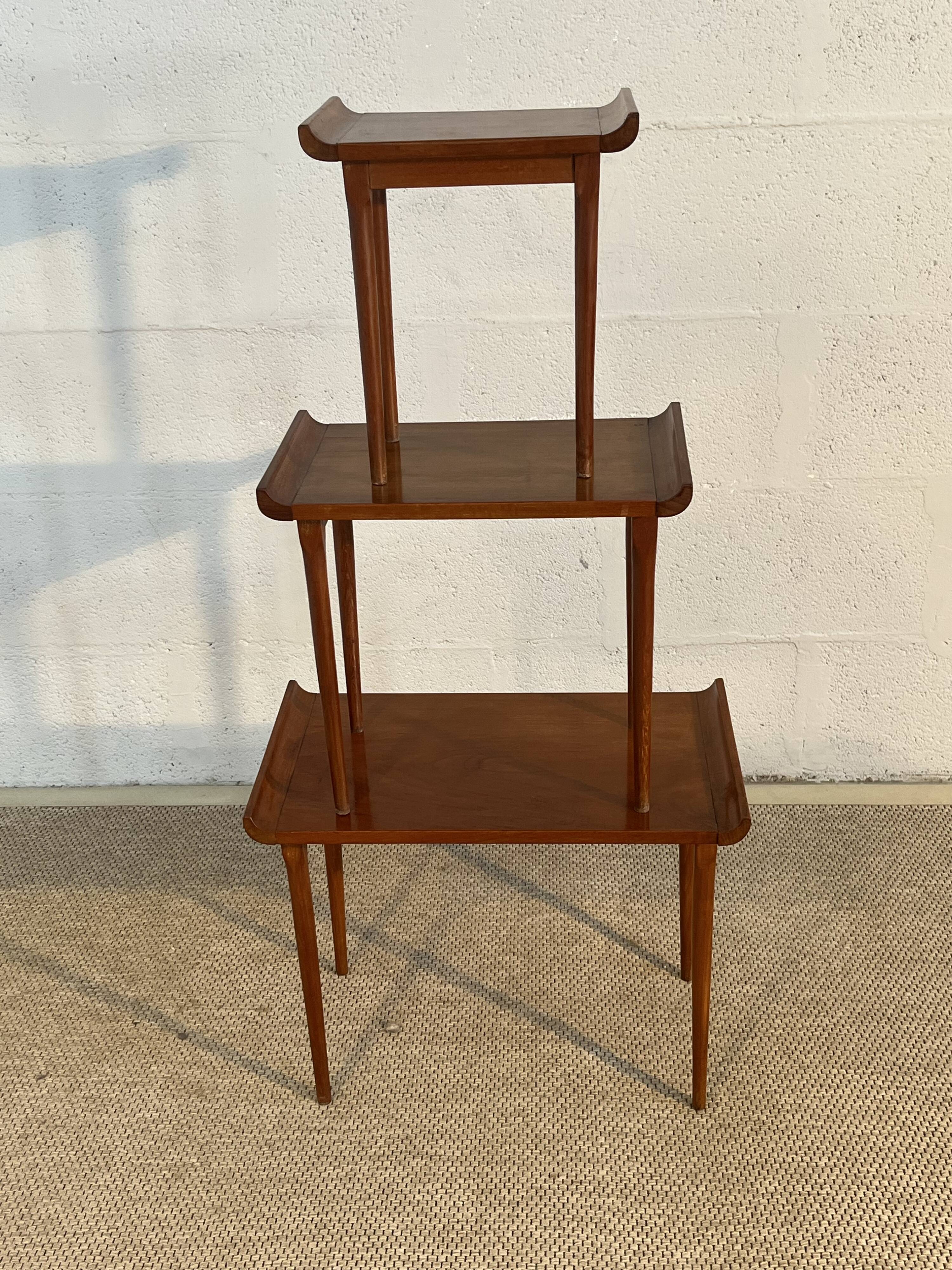 Set of three nesting low tables in a Japanese style, made of mahogany.
