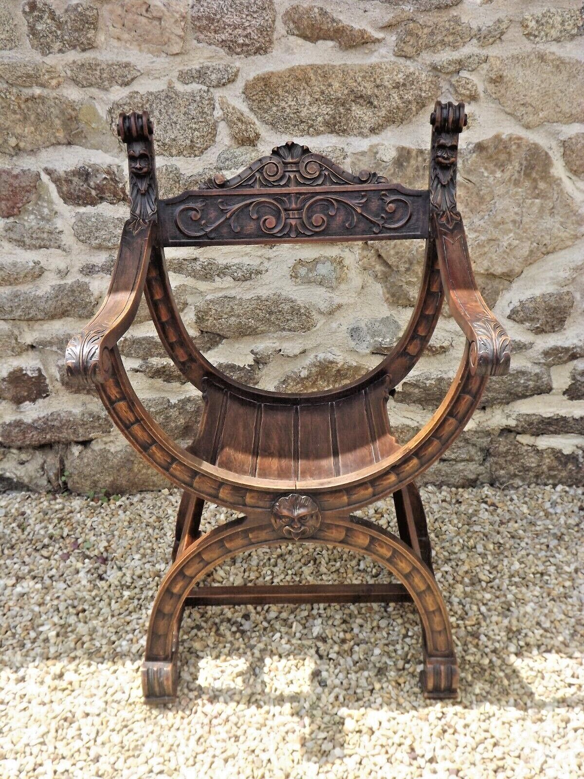 Dagobert armchair curule hard carved walnut demon head detail 3675