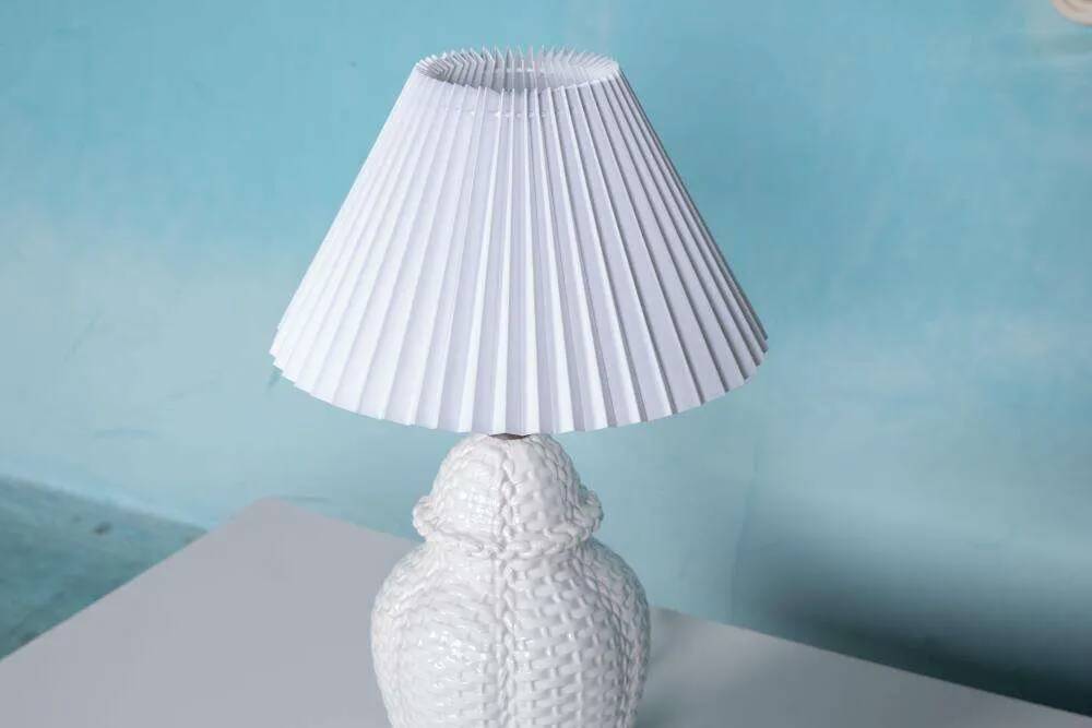 Vintage table lamp in woven ceramic Regency style.