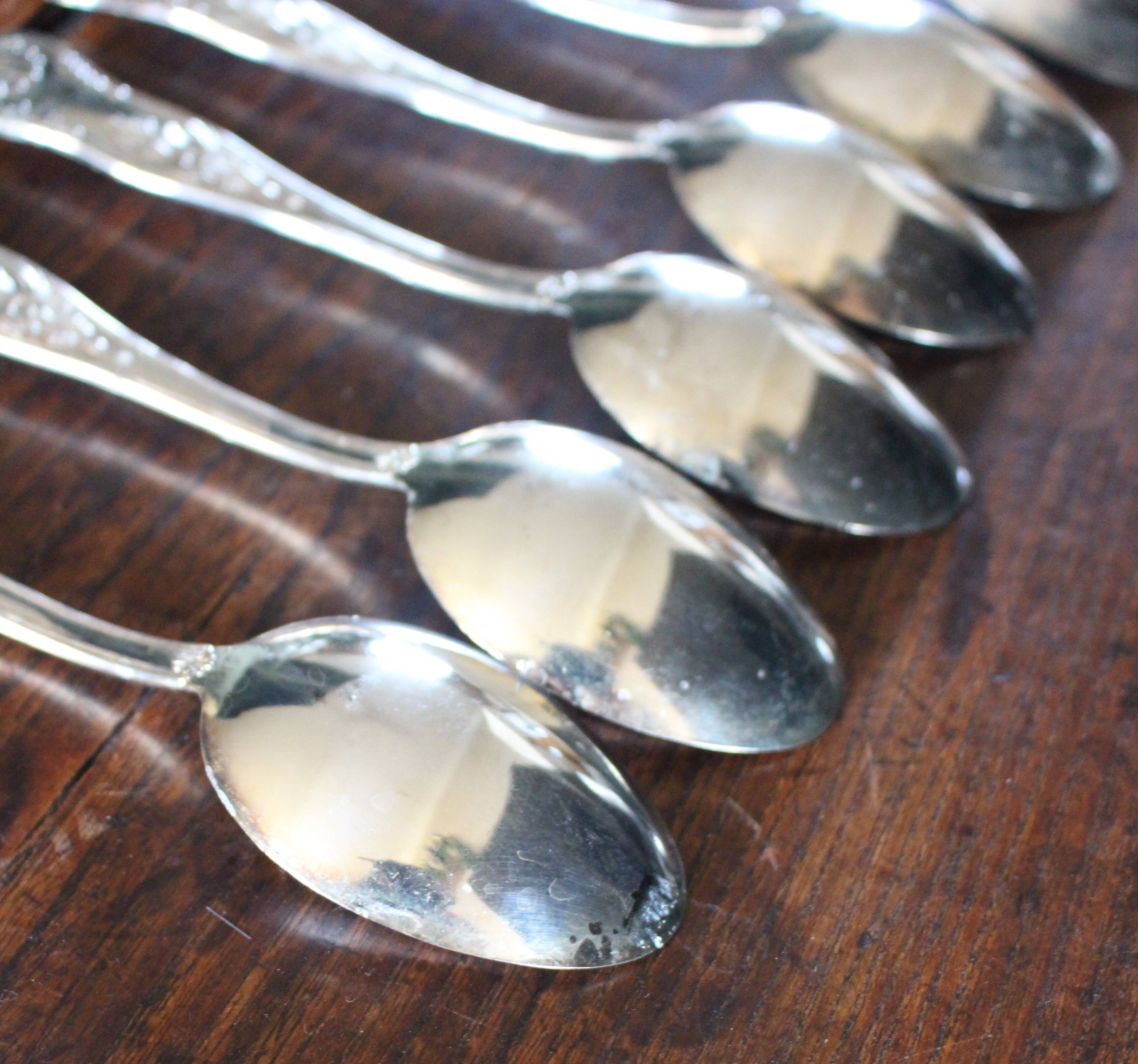 A set of 7 large metal shell spoons