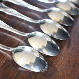 A set of 7 large metal shell spoons