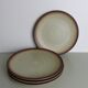 Set of 4 flat plates in speckled sandstone