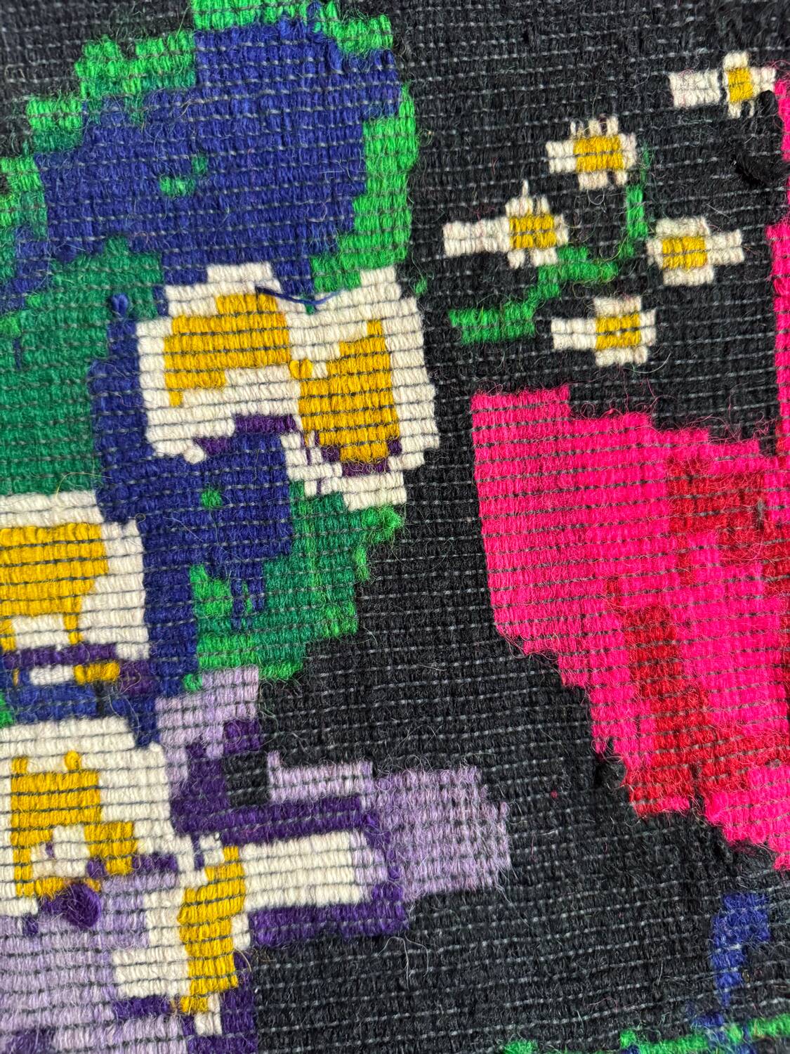 Romanian black wool carpet with a basket of colorful flowers