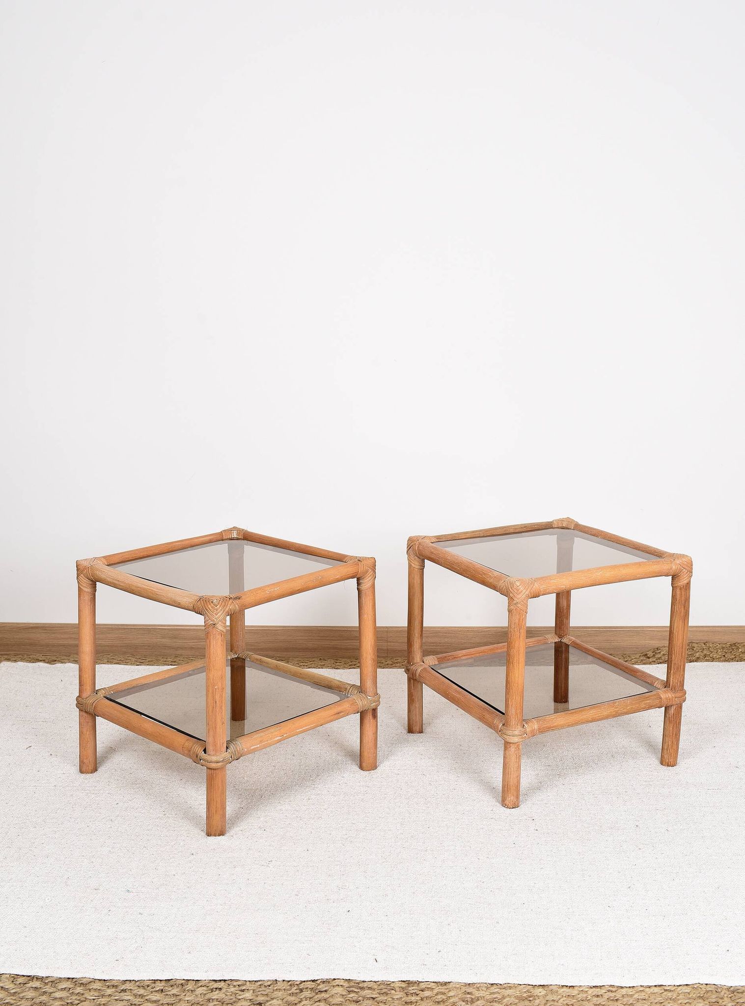 Pair of bedside tables or side tables, in rattan and smoked glass