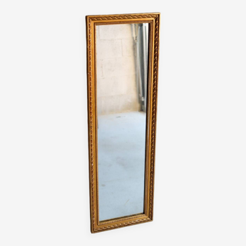 Long mirror in wood and vintage gilded stucco