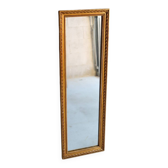 Long mirror in wood and vintage gilded stucco