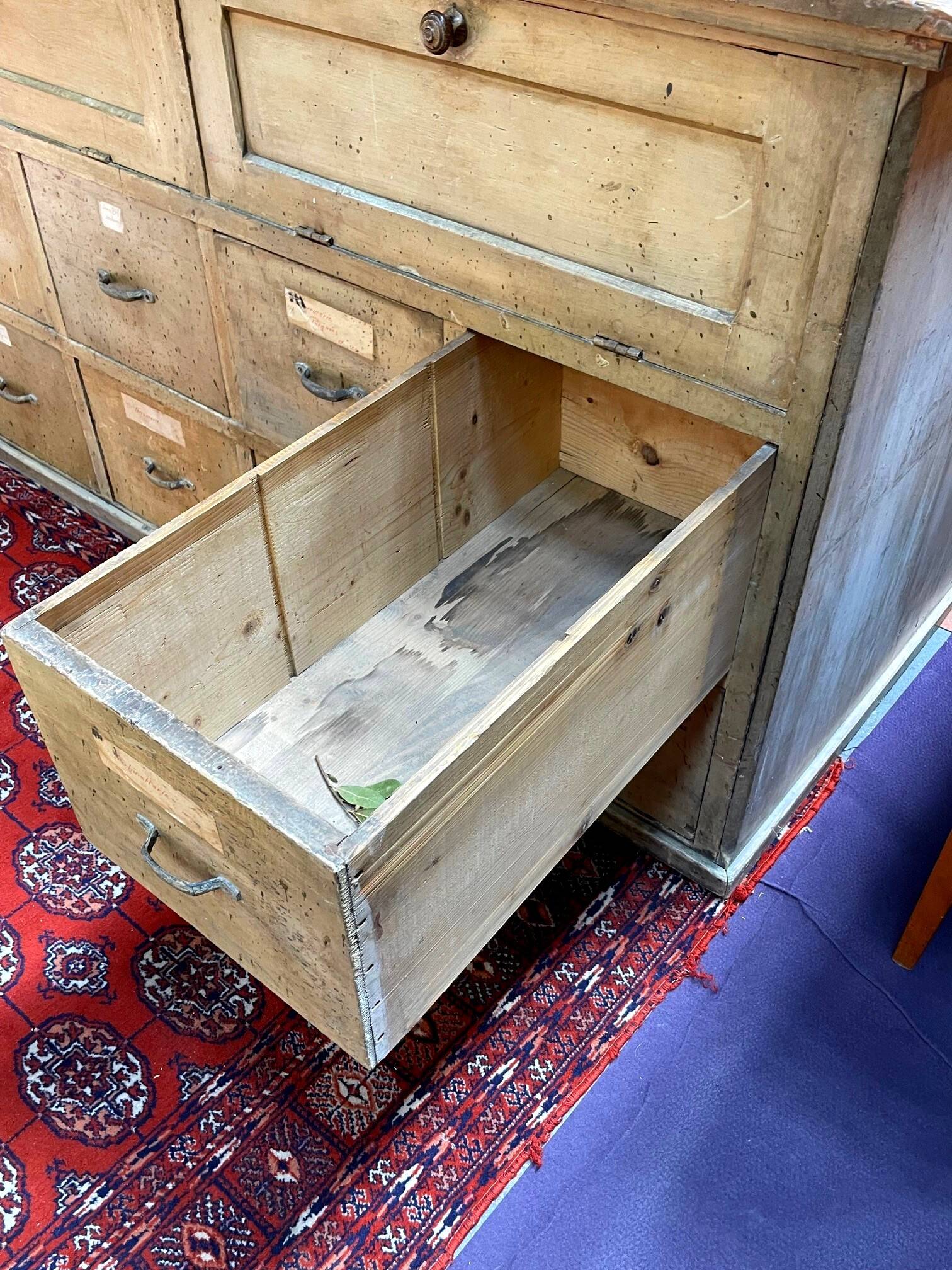 Old workshop furniture in good condition. 8 drawers and 2 drop-down doors, very