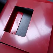 Vintage red metal wall magazine rack