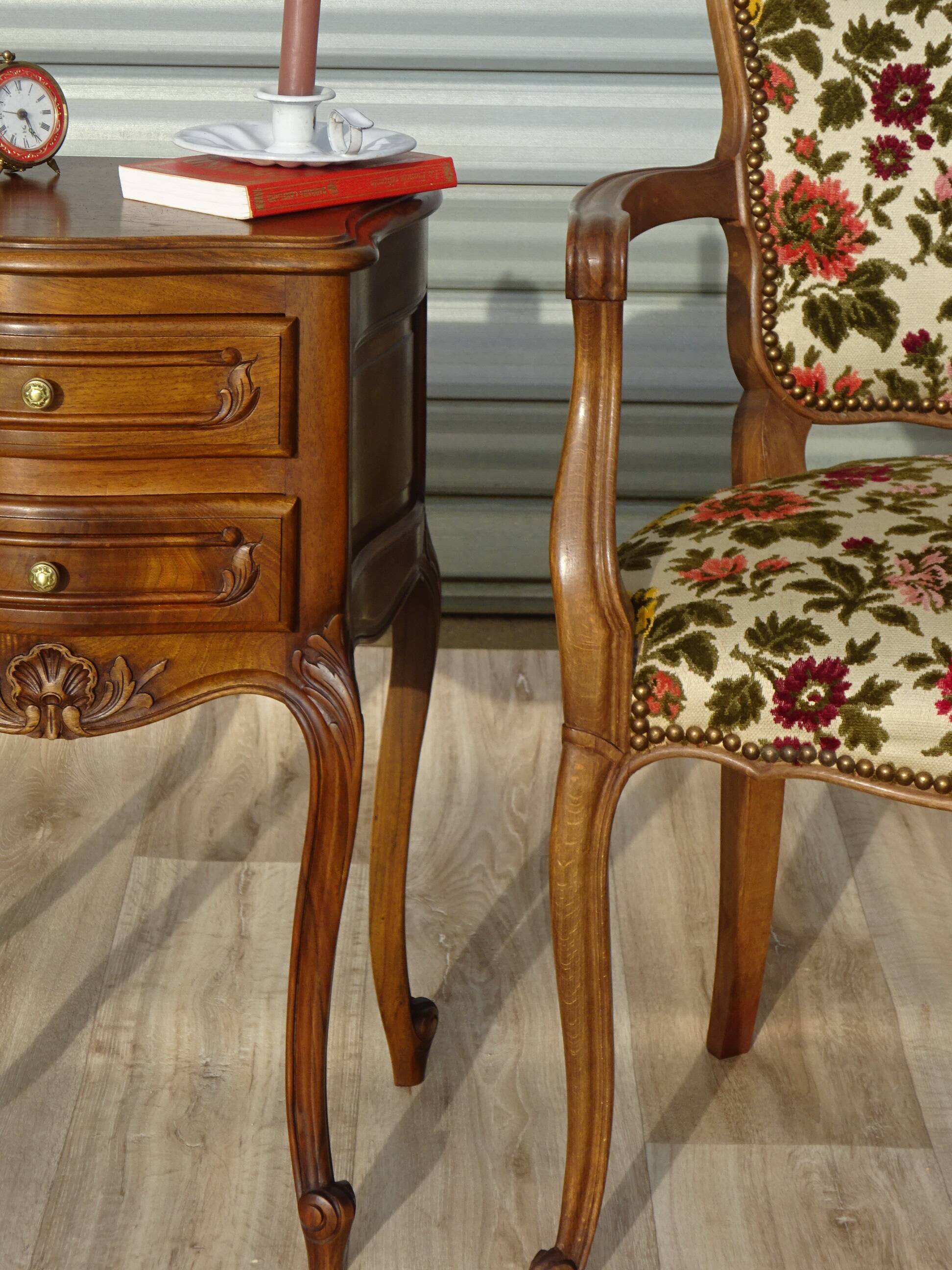 Convertible armchair with brocade fabric and floral patterns.