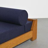 Wooden bench with midnight blue fabric, France, circa 1955