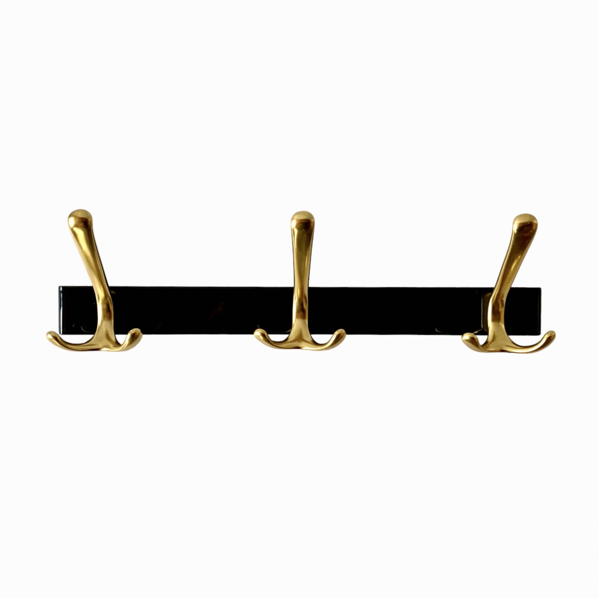 Vintage coat rack in lacquered metal with three golden aluminum hooks