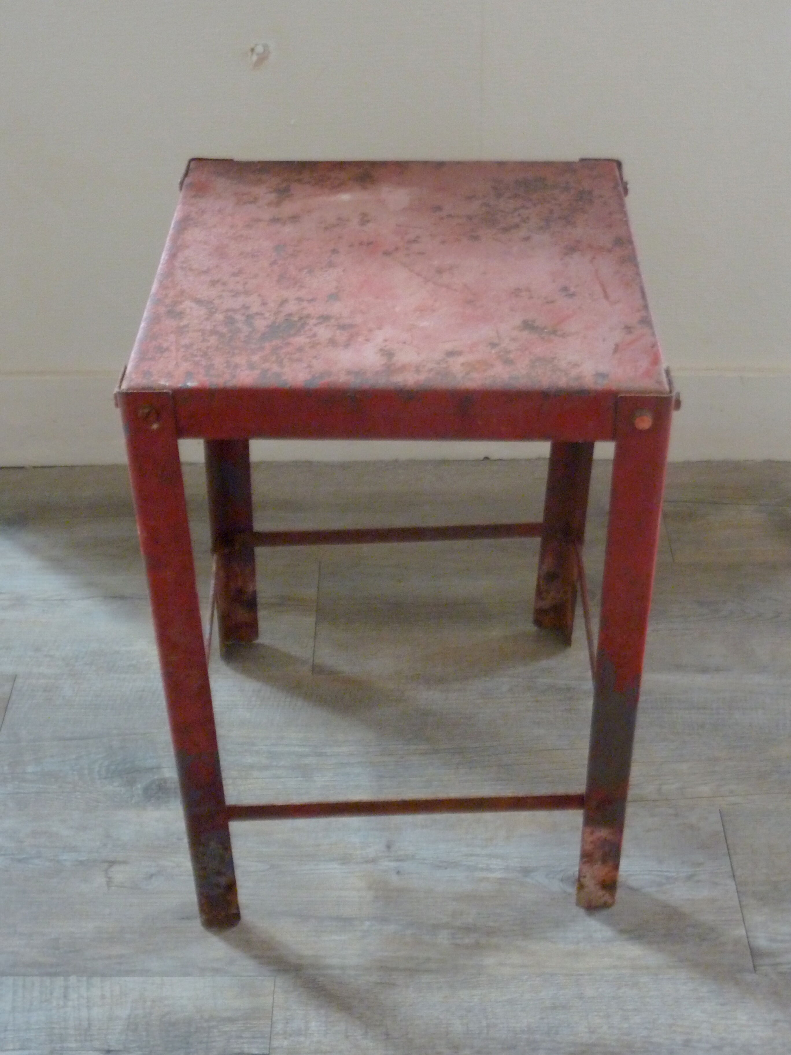 Red metal workshop stool