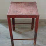 Red metal workshop stool