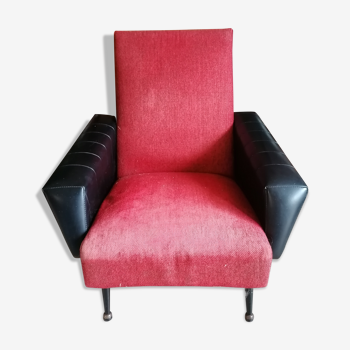 Red and black chair with brass feet