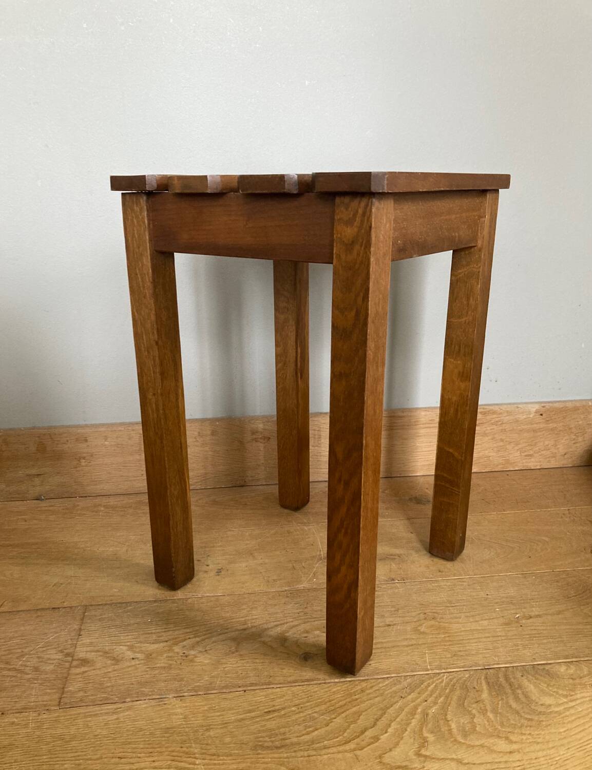 Wooden stool with central grip, quadripod base, 20th century