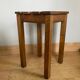 Wooden stool with central grip, quadripod base, 20th century