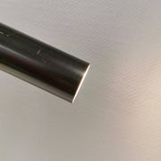 Two cylinder-shaped hanging lamps in black lacquer