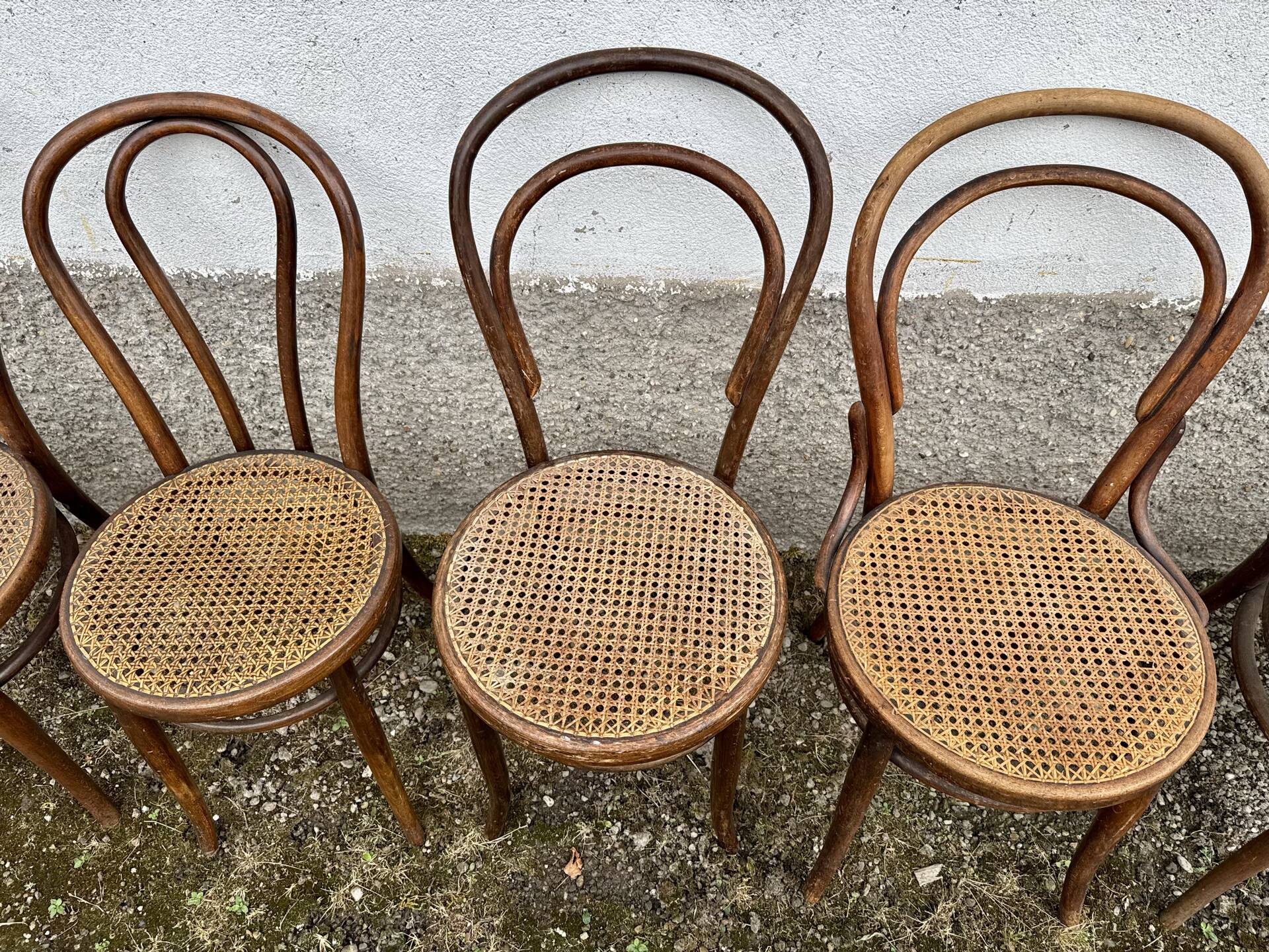 Set of 10 bentwood bistro chairs with cane seat.