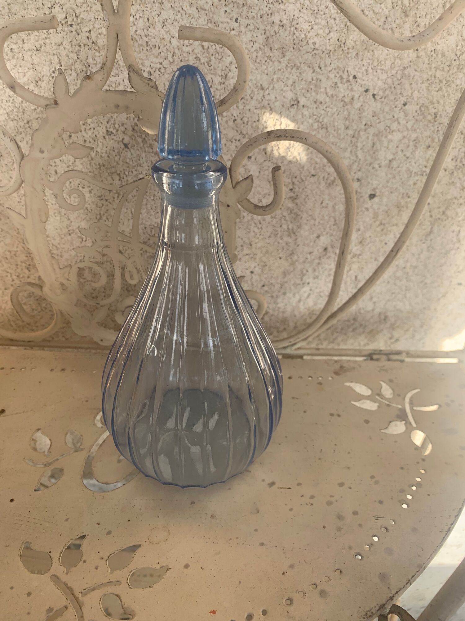 Liquor service consisting of a blue glass decanter and. 3 small antique glasses