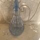 Liquor service consisting of a blue glass decanter and. 3 small antique glasses
