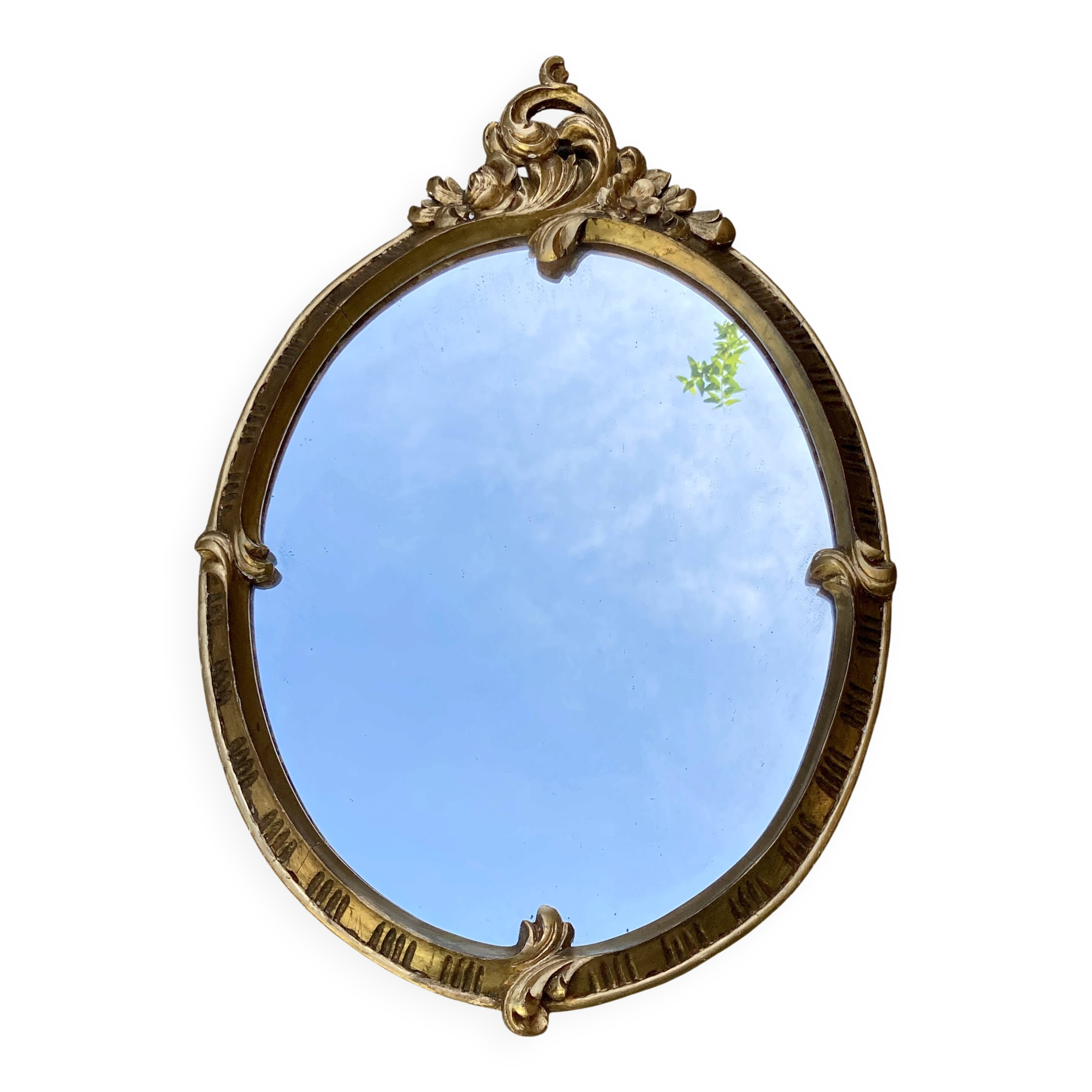 Oval mirror - wood and gilded stucco with decoration of