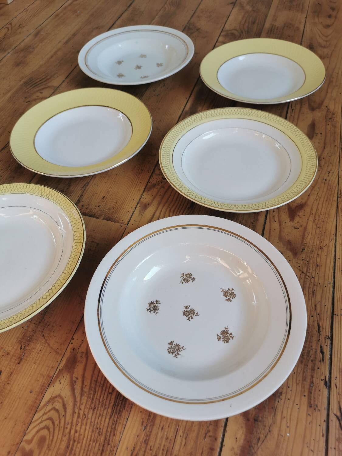 Vintage mismatched yellow and gold soup plates