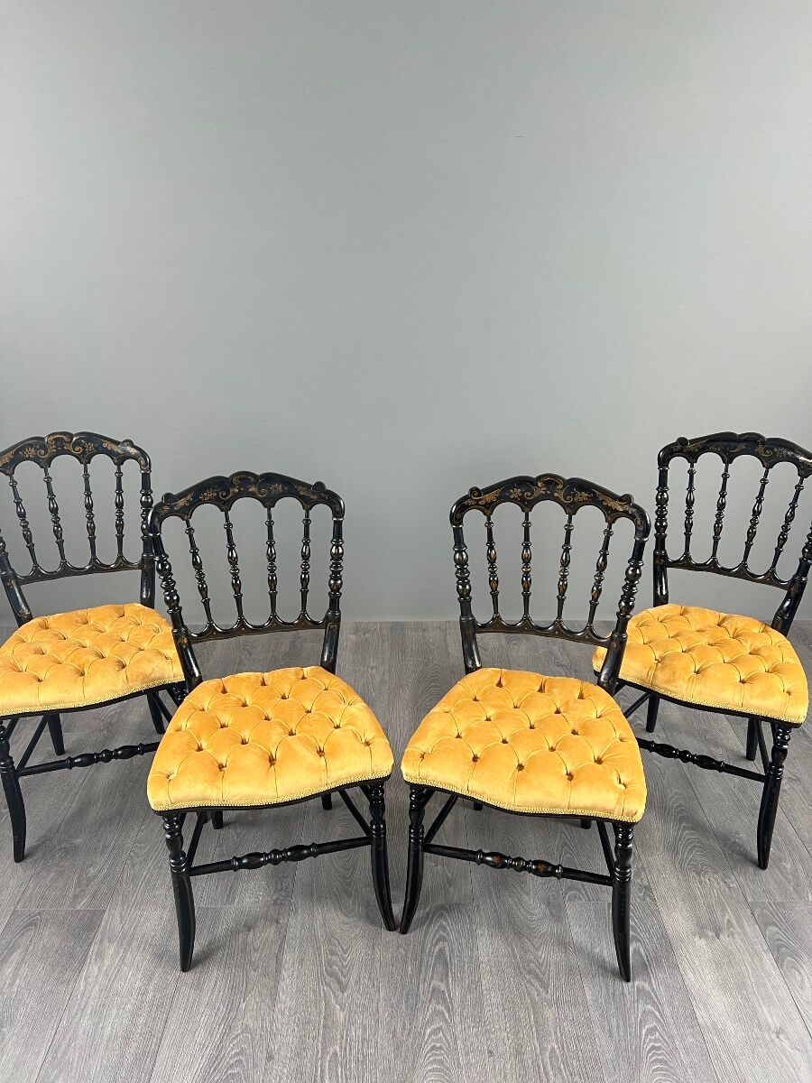 Set of four Napoleon III chairs in blackened wood, 19th century.