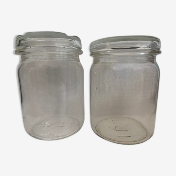Two old vintage white glass jars