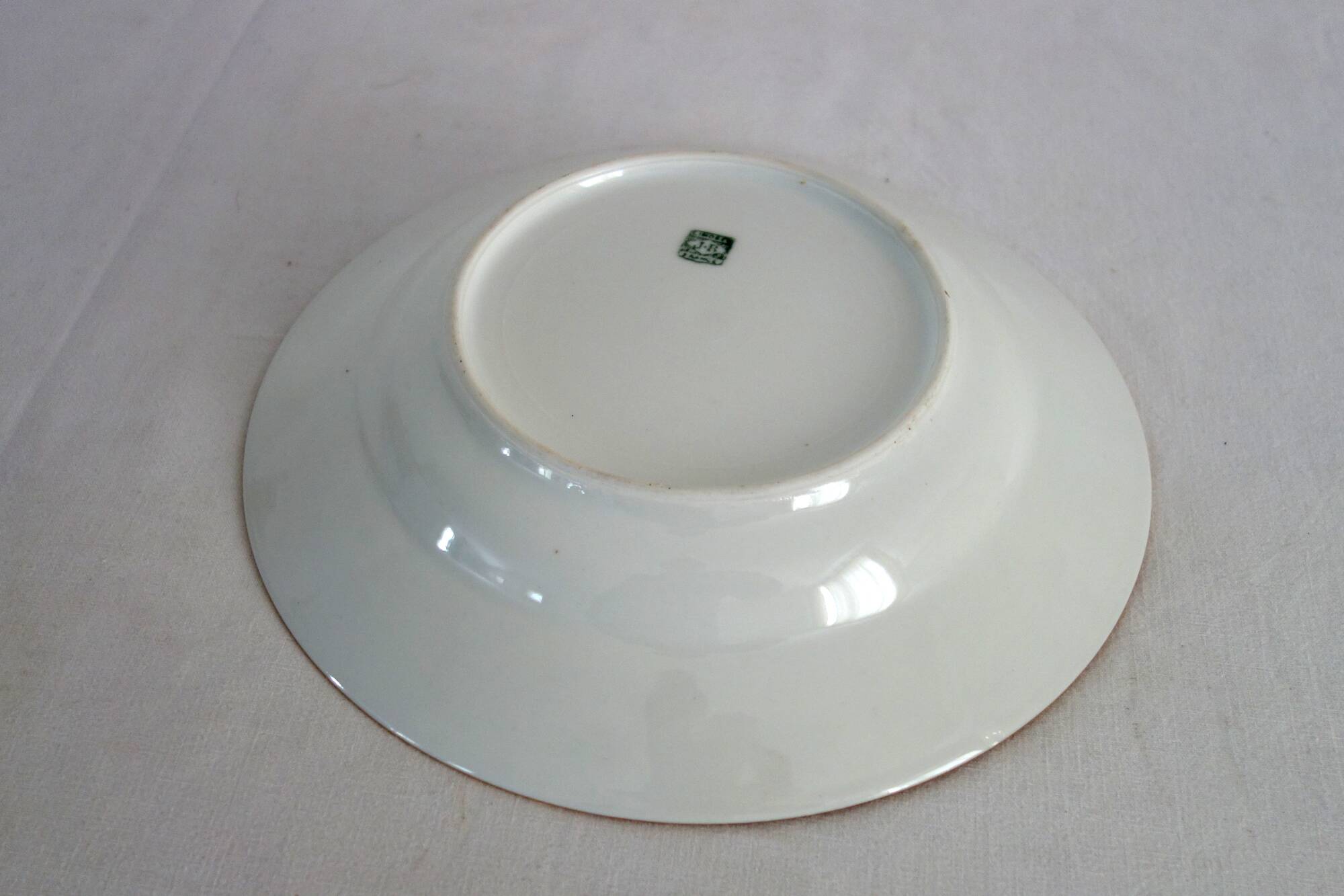 Set of 11 Limoges porcelain soup plates
