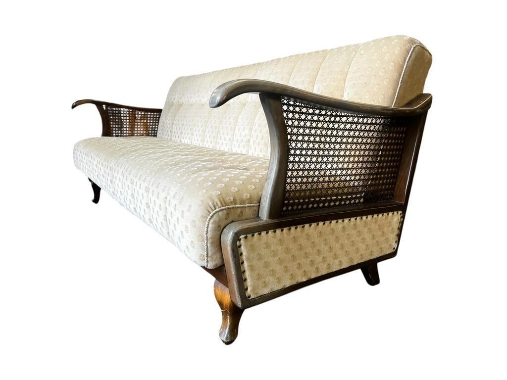 Vintage wooden armchair with rattan weaving.