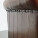 Sheepskin leather armchair in a cognac color with black piping