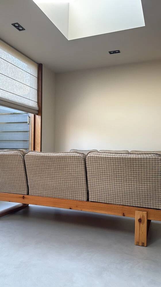 Two vintage Swedish sofas and a pine table