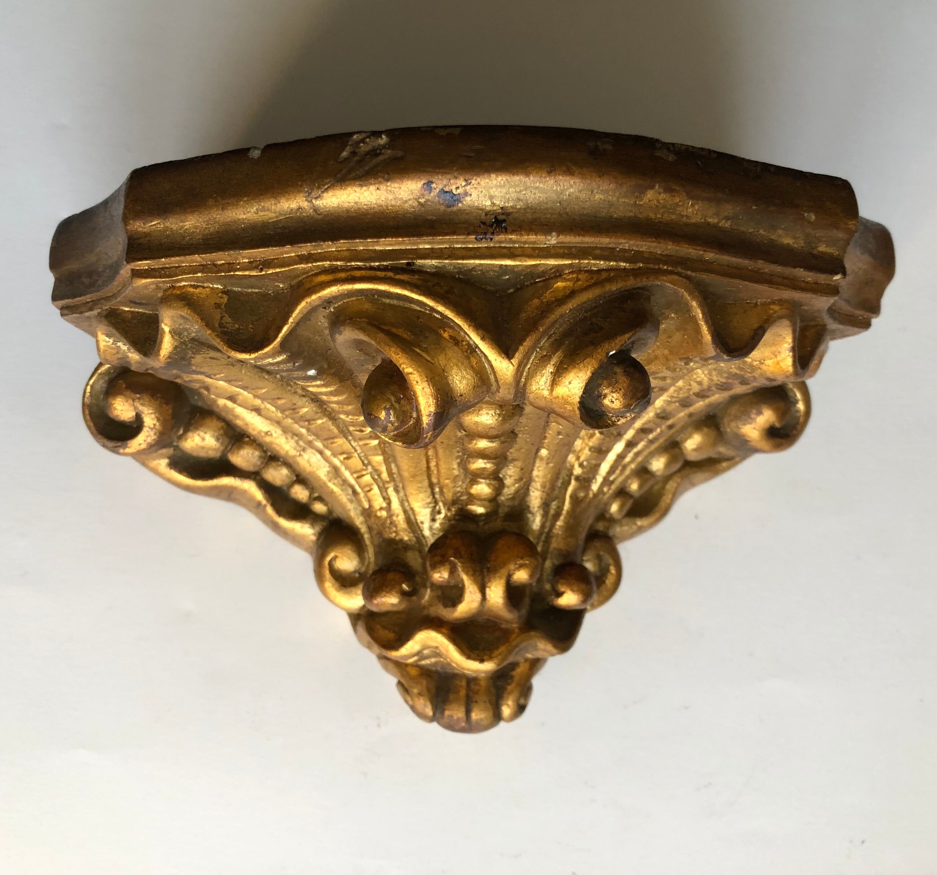 Wall console in gilded plaster