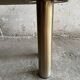 Memphis coffee table in black/gray granite and brushed stainless steel — sculptural double-tiered table in a postmodern 1980s style